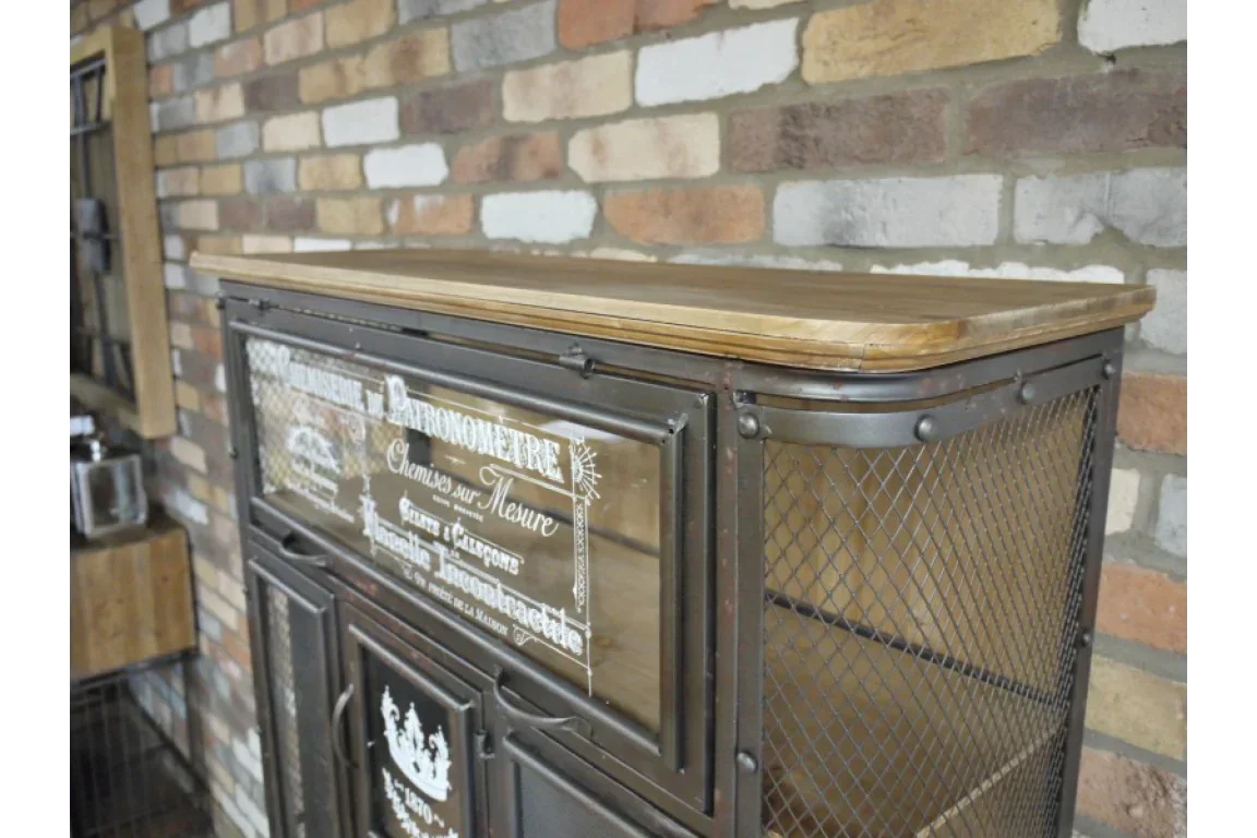 Industrial storage cabinet with wood top and mesh metal doors against brick wall