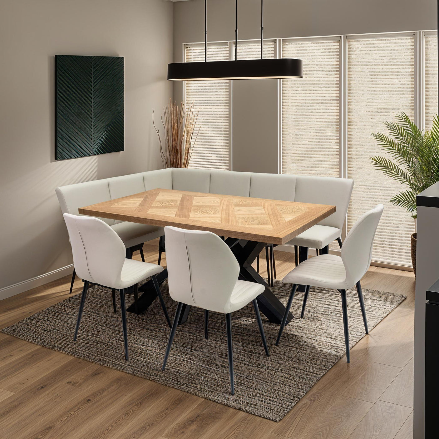 Corner dining set with wood table, cream upholstered chairs and bench, on woven rug