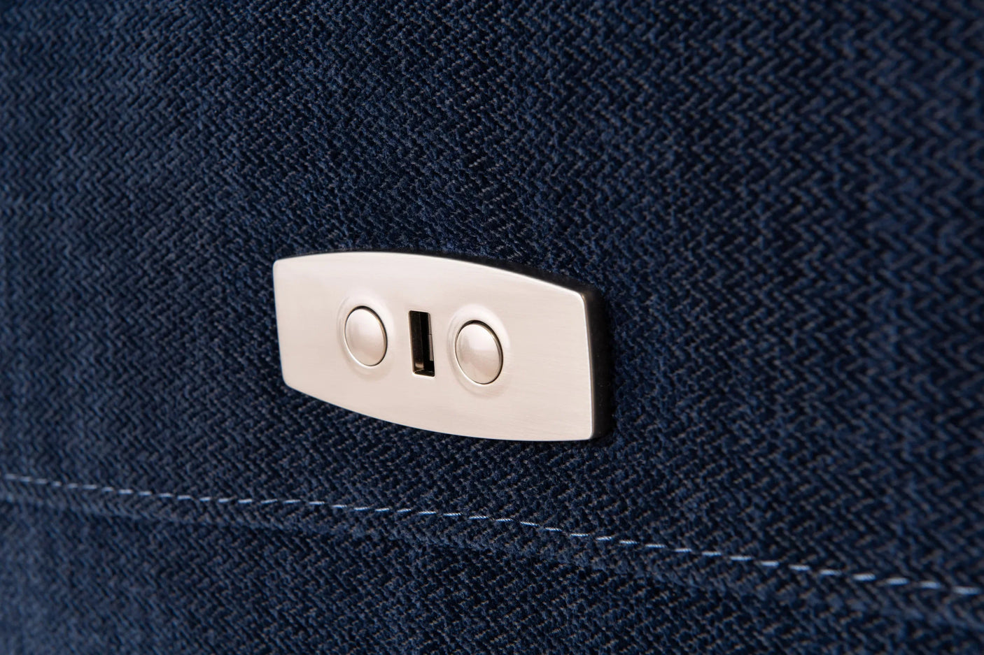 Close up of blue fabric sofa with built-in USB charging port and control buttons