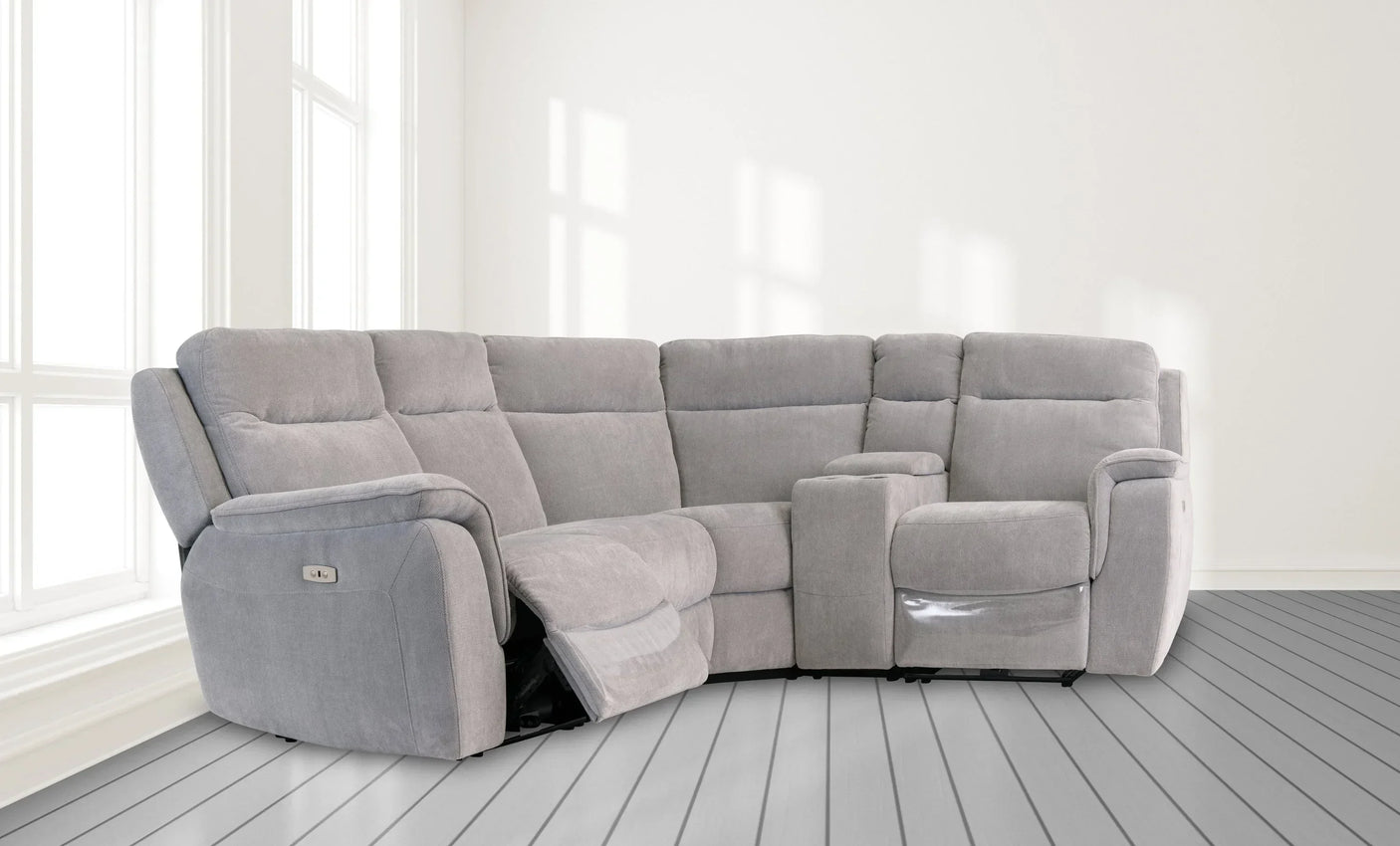 Silver grey fabric corner sofa with recliner seats and armrests in bright living room