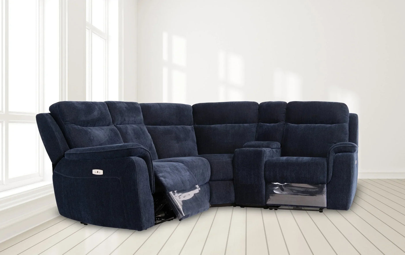 Navy blue fabric corner sofa with reclining seats in a bright living room