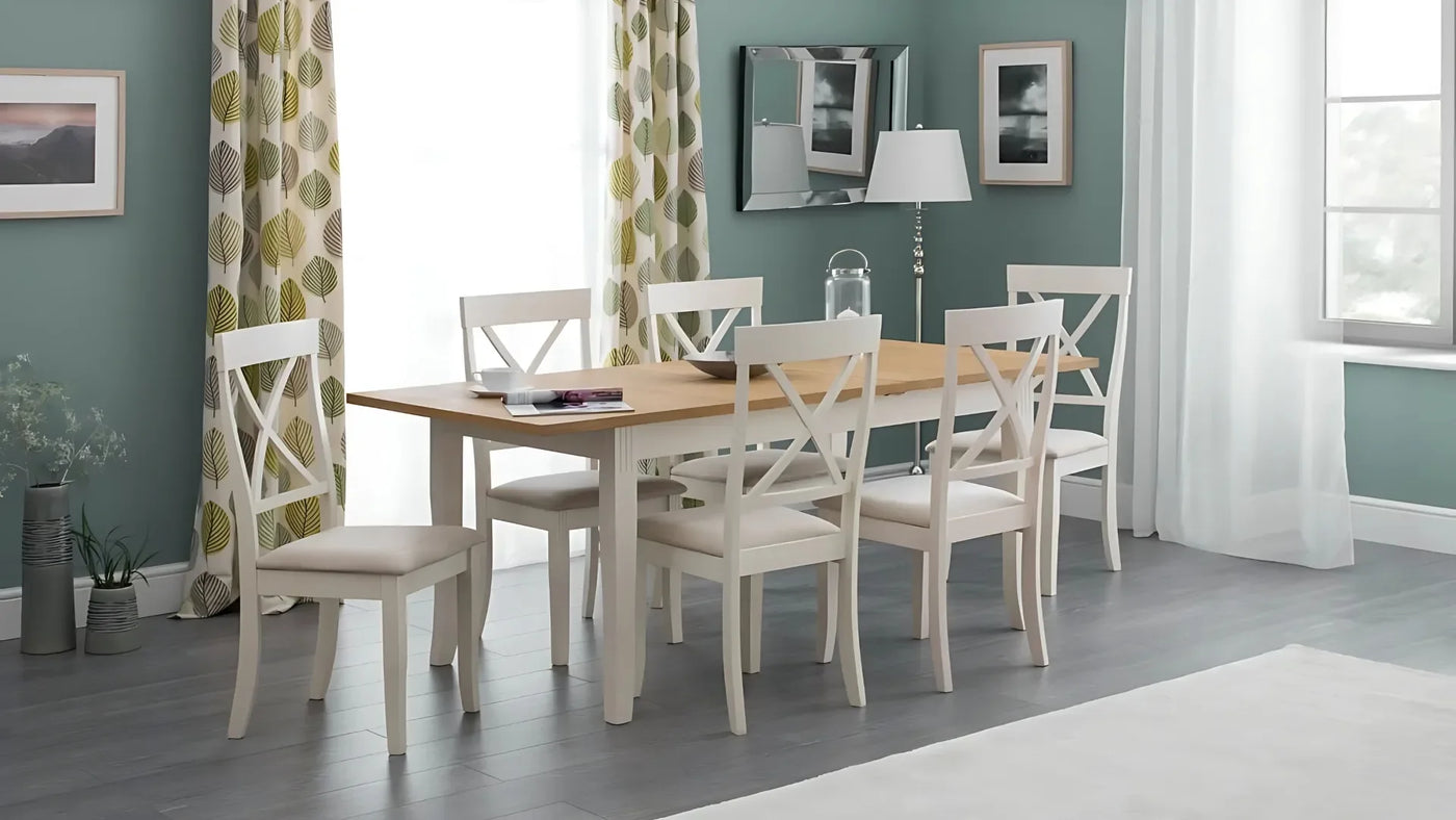 Wood dining table with six white chairs in modern dining room setting