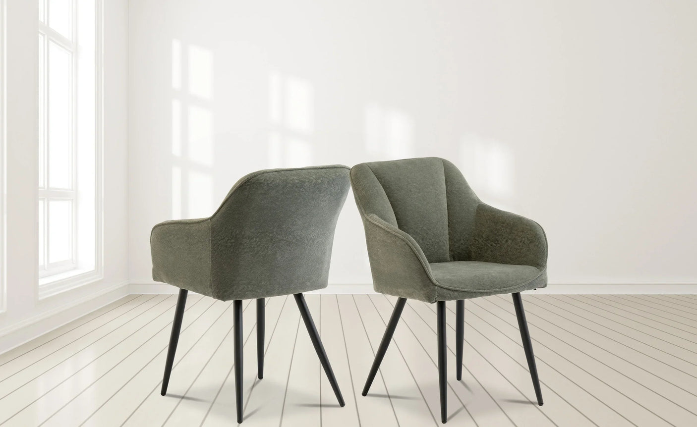 Pair of grey upholstered accent chairs with metal legs on light wood floor