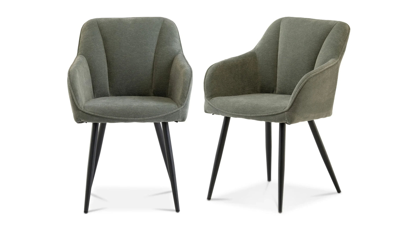 Pair of green fabric dining chairs with curved backs and black tapered legs