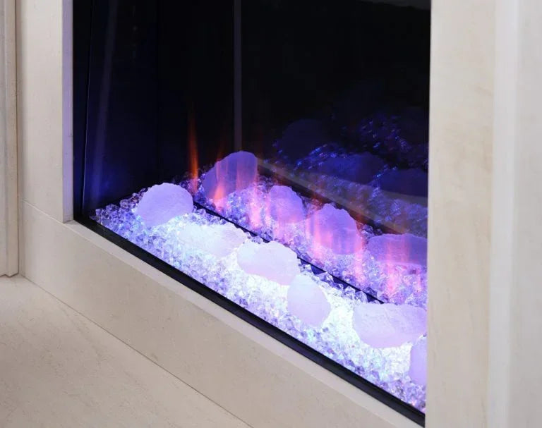 Electric fireplace close-up with crystal embers and purple LED lights in glass front