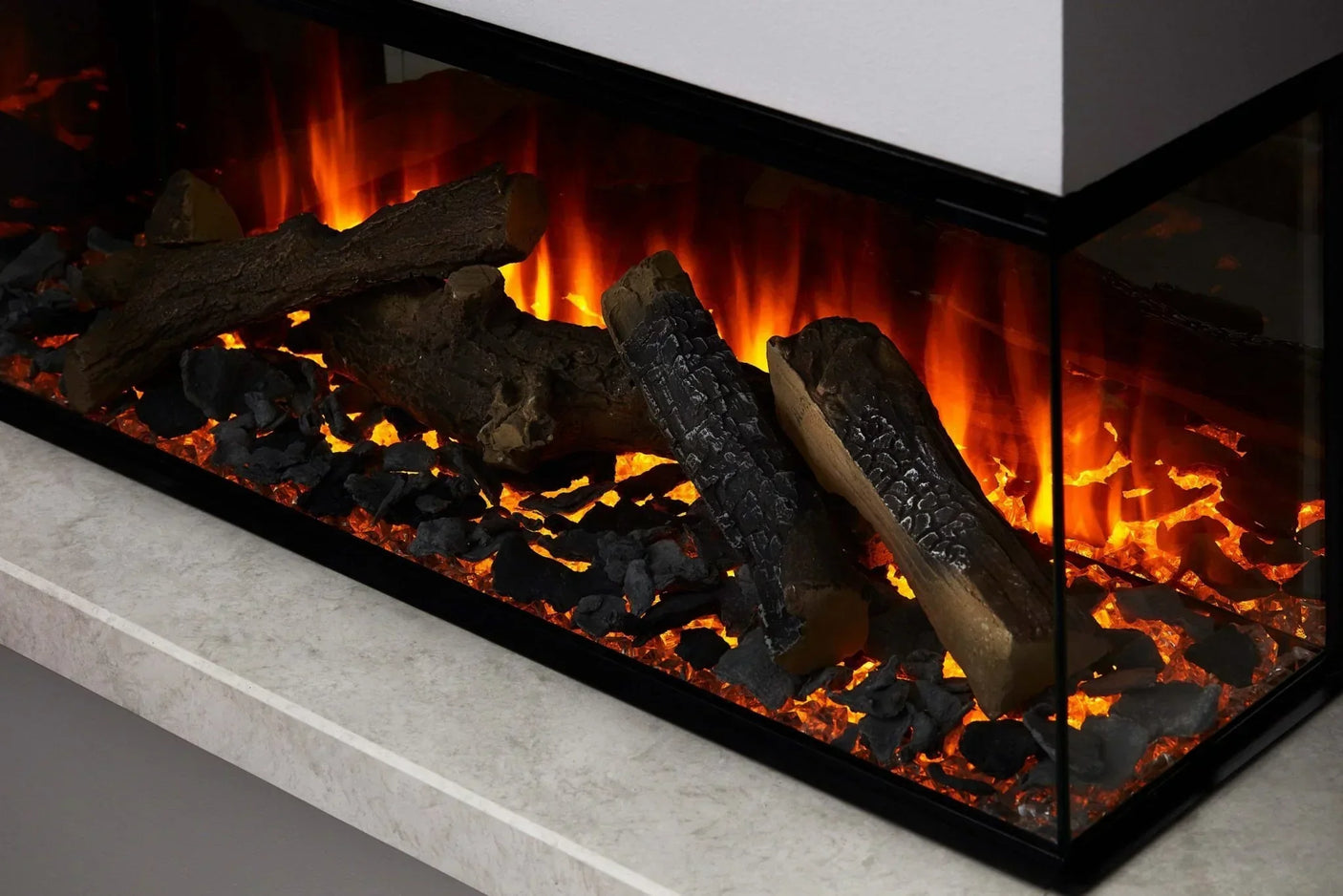 Close up of electric fireplace with realistic log effect and glowing ember bed