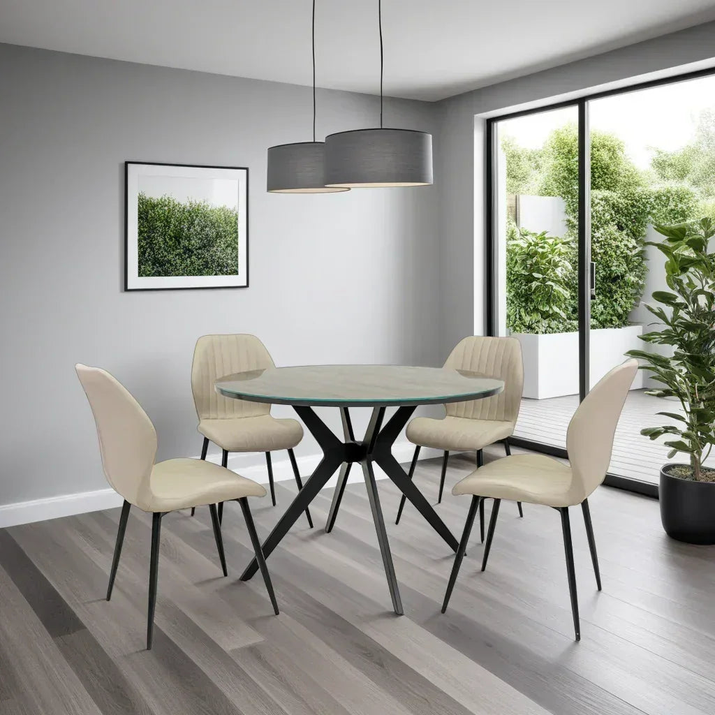 Round glass dining table with four cream chairs in modern dining room