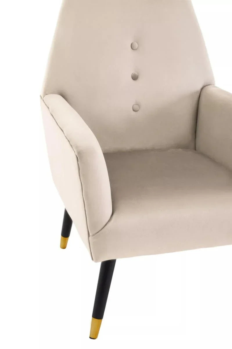 Stone velvet accent chair with button detail and black legs with gold tips