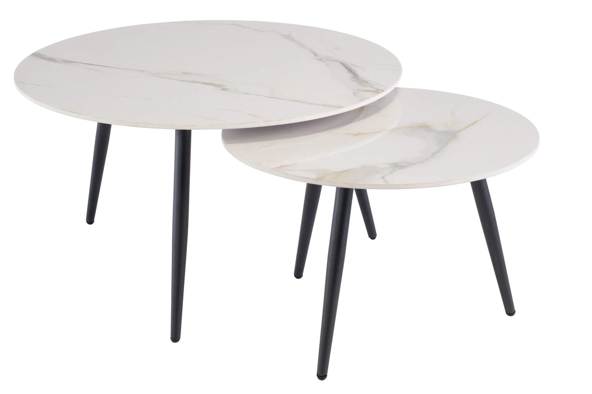 Two round white marble-effect nesting coffee tables with black metal legs