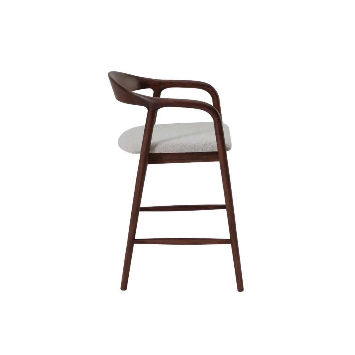 Side profile of wooden barstool with curved backrest and light upholstered seat