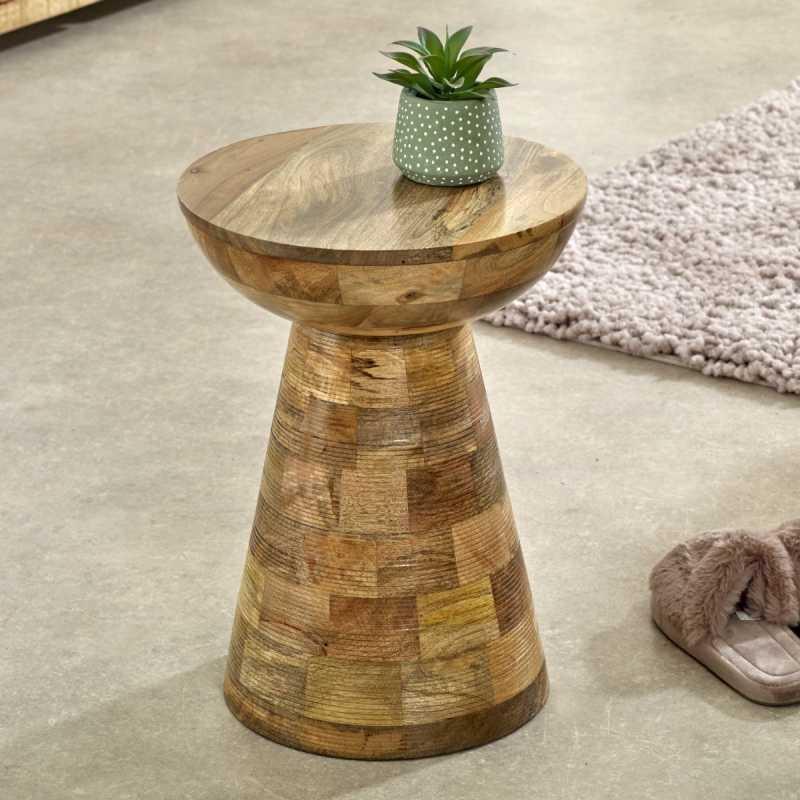 Solid wood side table with natural finish and plant pot on top, set on a beige floor
