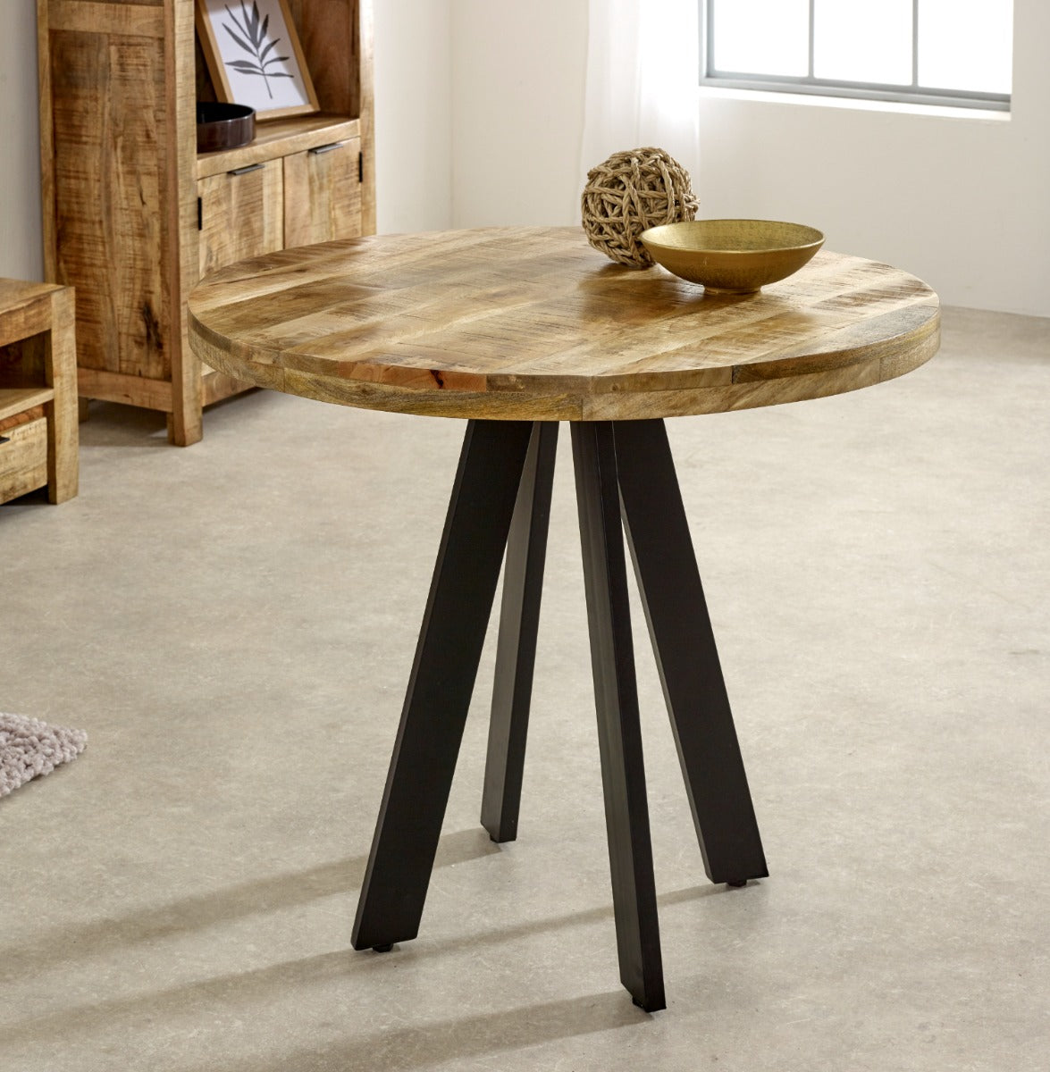 Surrey Round Dining Table made of mango wood with metal legs