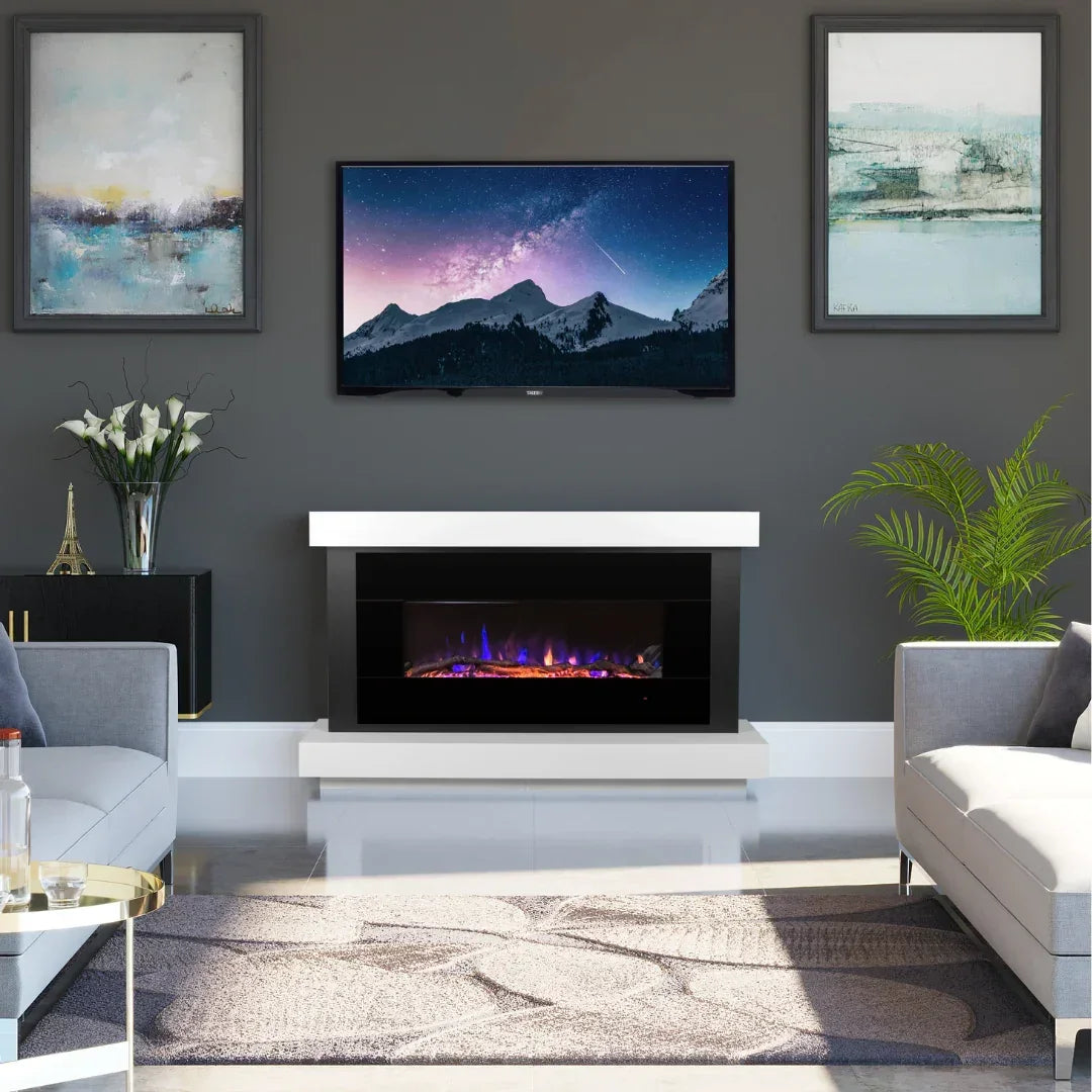 Modern living room suite with grey sofas, electric fireplace, and wall-mounted TV