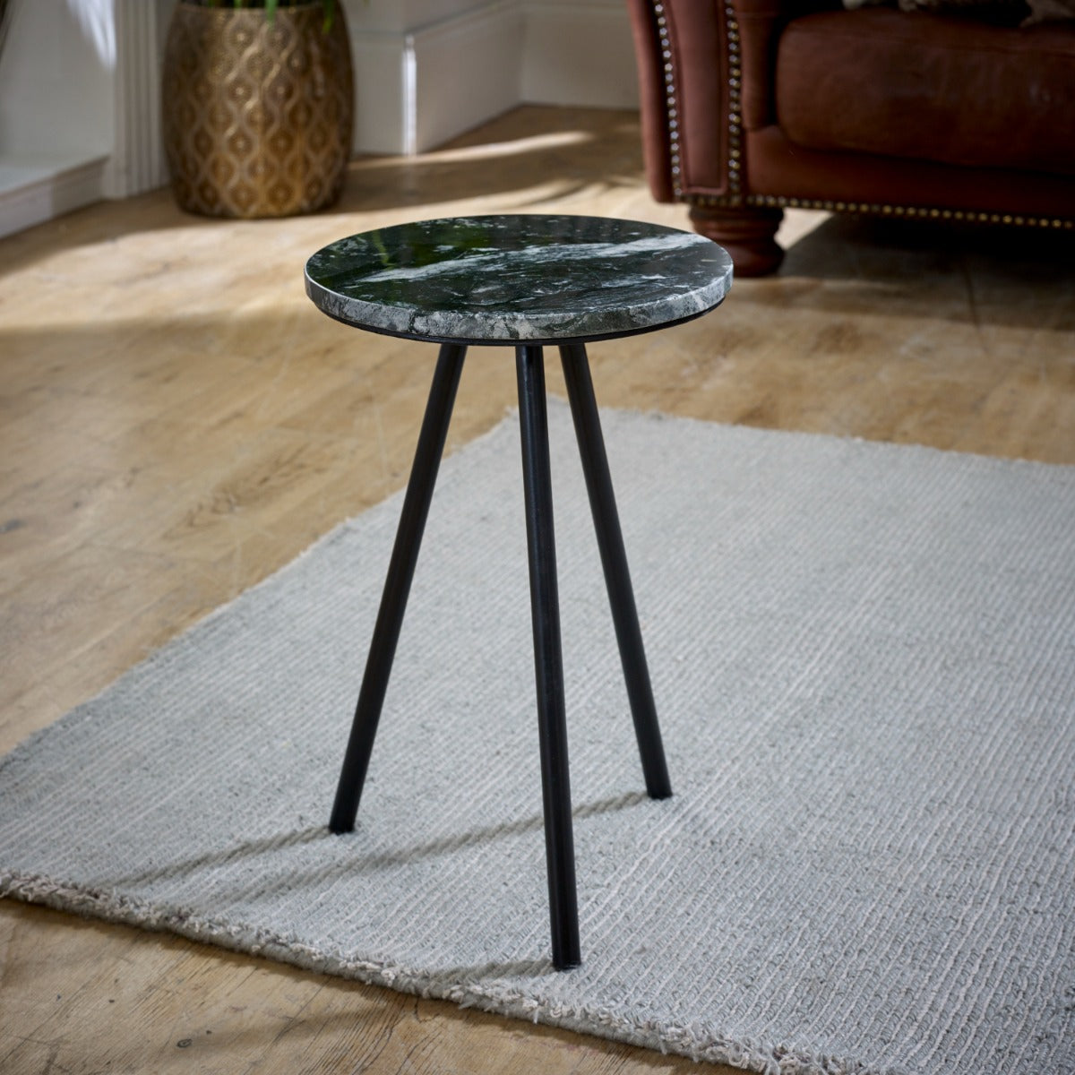 Opal side table with black marble top and metal legs, minimalist design