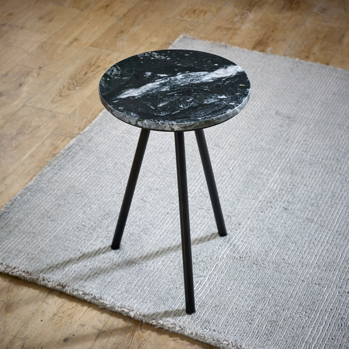 Opal side table with black marble top and metal legs, minimalist design