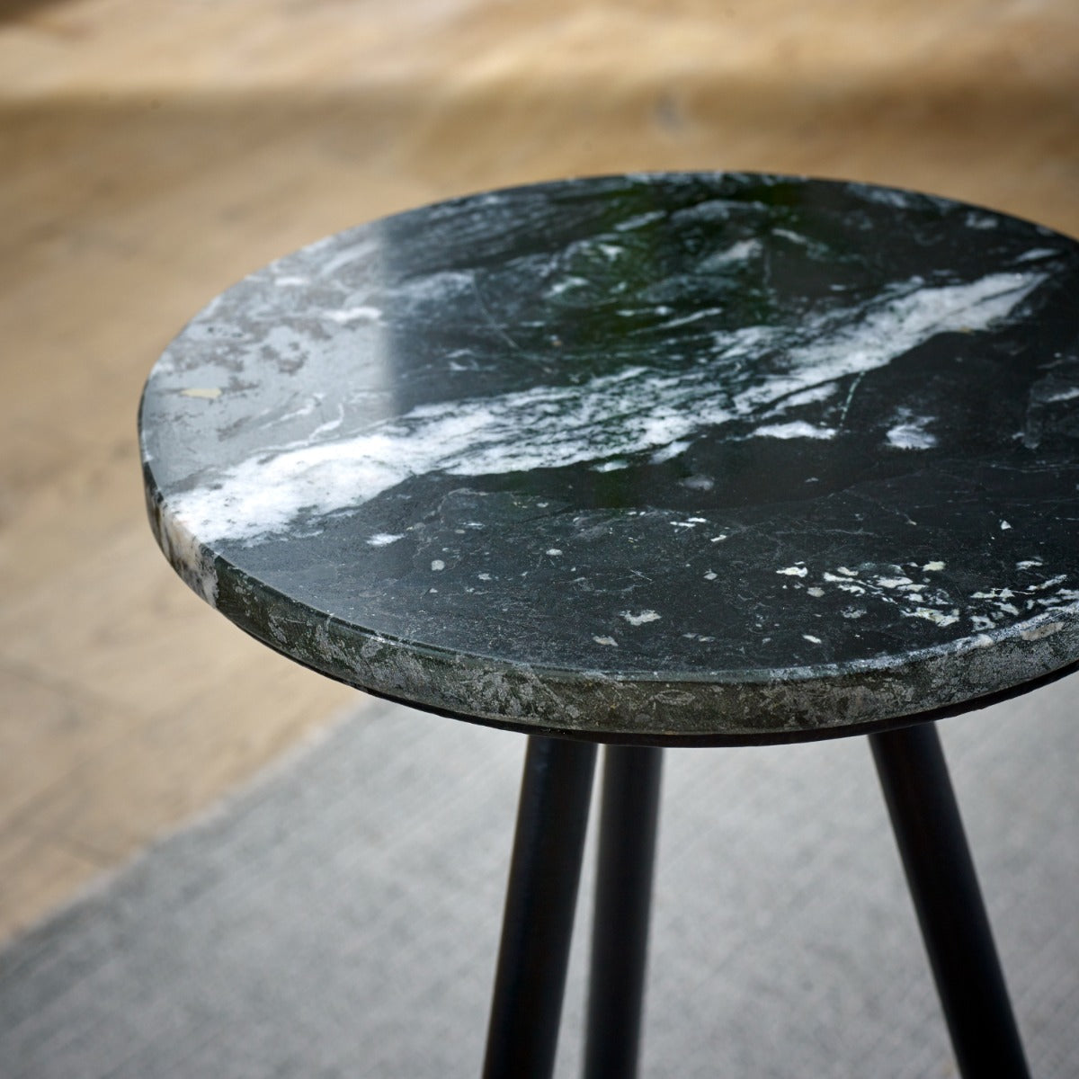 Opal side table with black marble top and metal legs, minimalist design