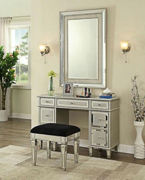 Mirrored dressing table set with black cushioned stool and large wall mirror in bedroom