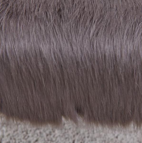 Grey faux fur rug close-up showing soft texture and dense fibers
