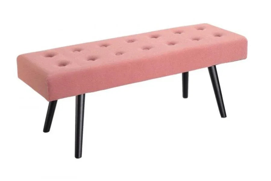 Pink upholstered bench with button tufted seat and angled black legs