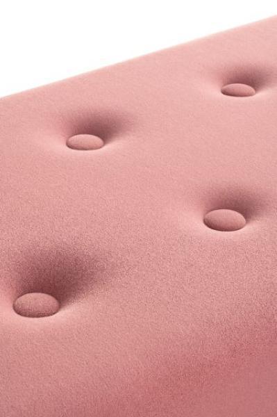 Pink upholstered sofa seat with button tufting detail