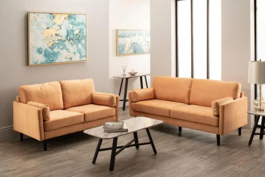 Modern orange fabric sofa set with matching armchairs in a bright living room