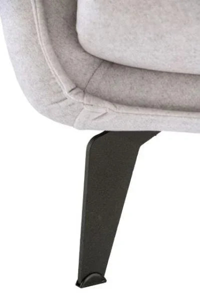Close-up of grey fabric sofa corner with black metal leg
