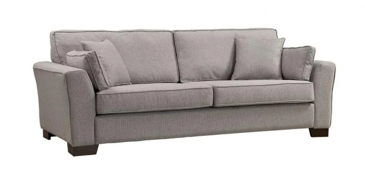 Grey fabric sofa with three seat cushions, matching back cushions and throw pillows