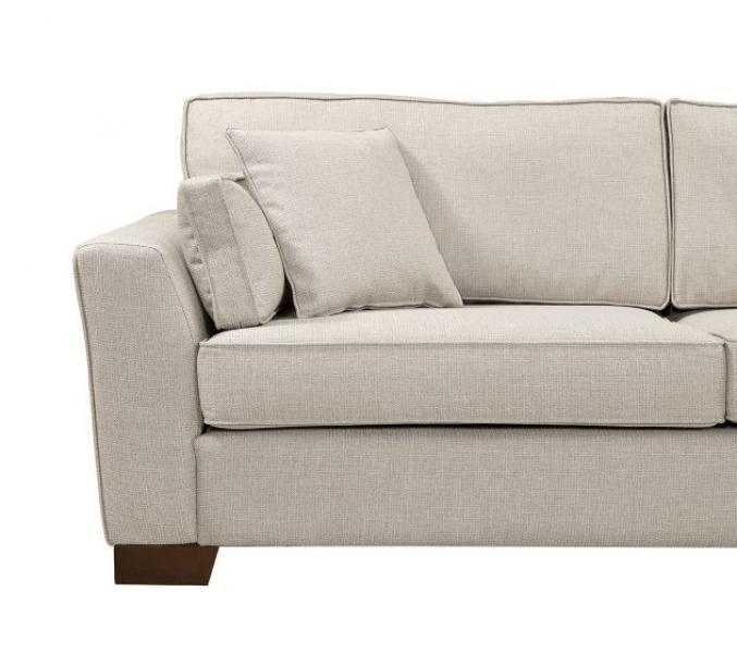 Beige fabric sofa with square armrest and two matching scatter cushions