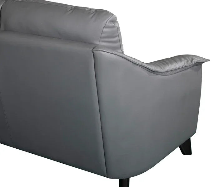 Back view of grey leather sofa with padded armrest and black legs