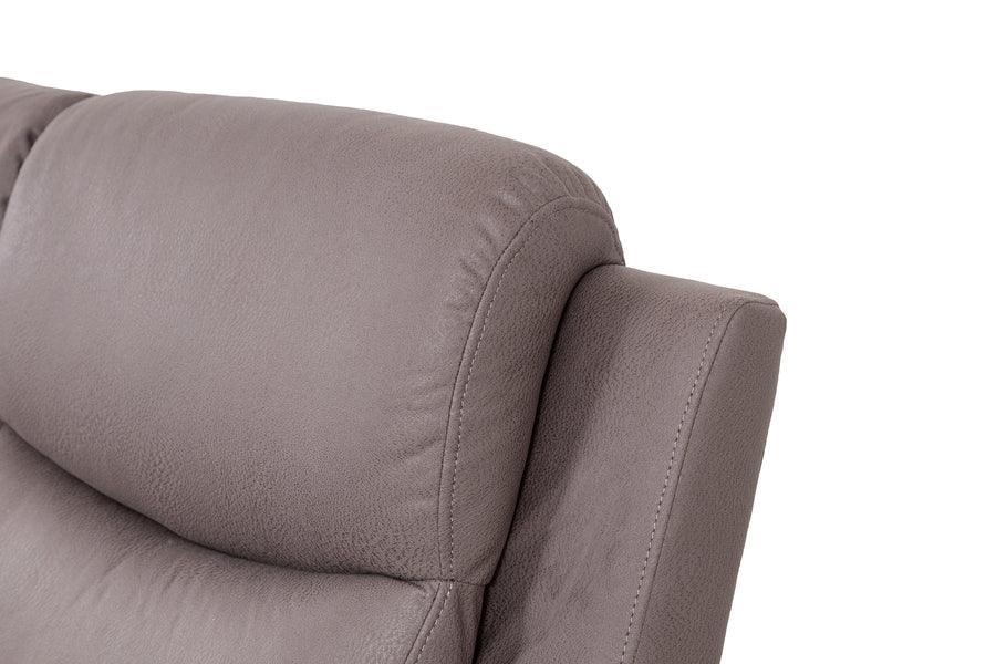 Close-up of taupe leather sofa headrest and cushioned armrest