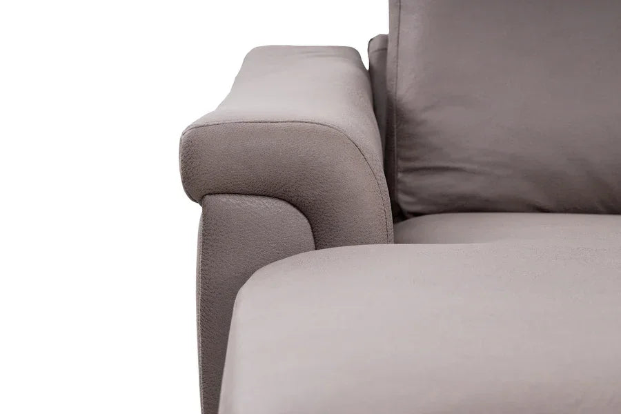 Close-up of grey fabric sofa armrest and seat cushion detail