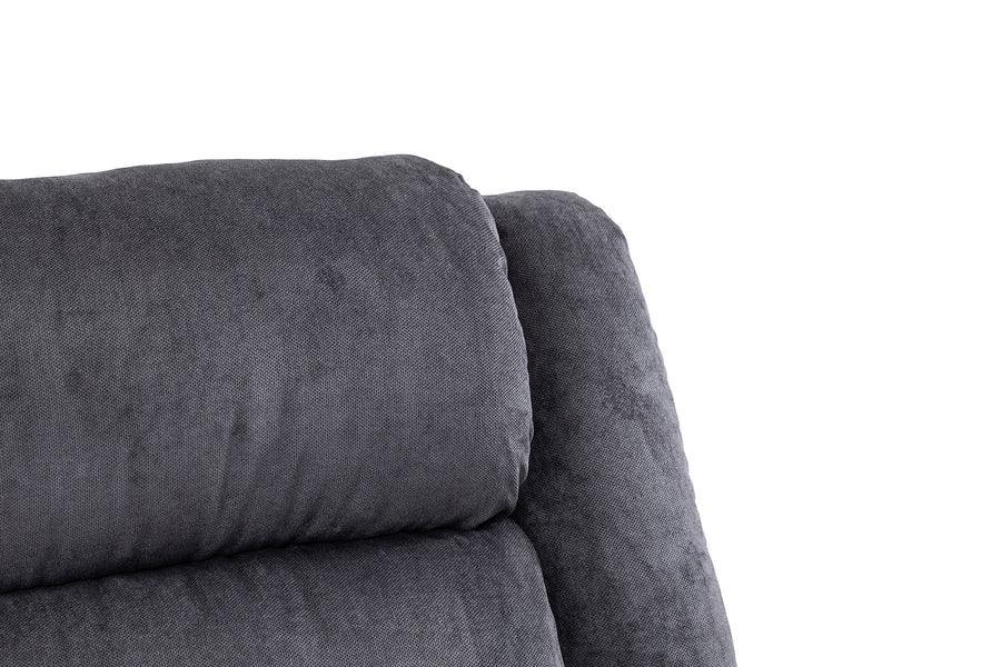 Close detail of dark grey fabric sofa backrest with plush cushioning