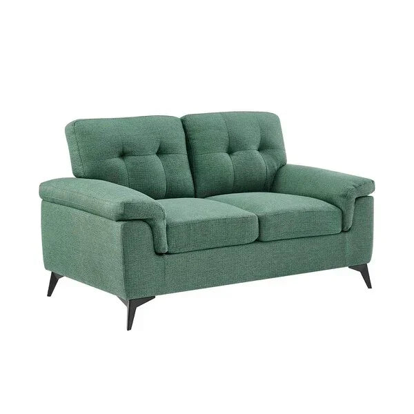 Green fabric sofa with button-tufted cushions and angled black legs, front angle view