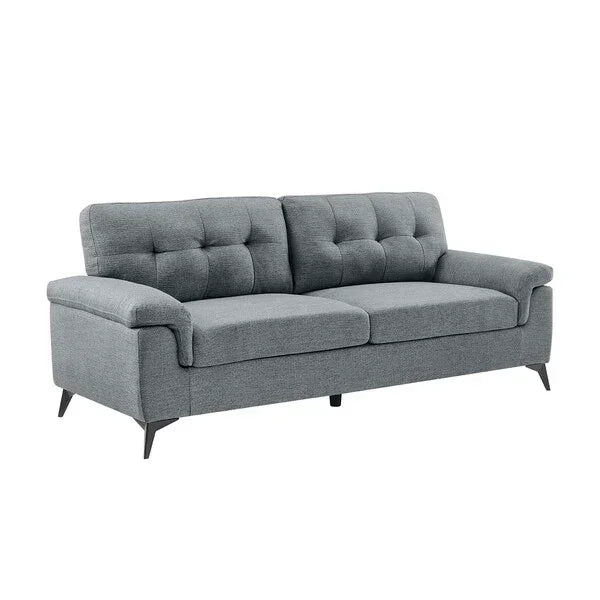 Grey fabric sofa with tufted backrest and black angled legs