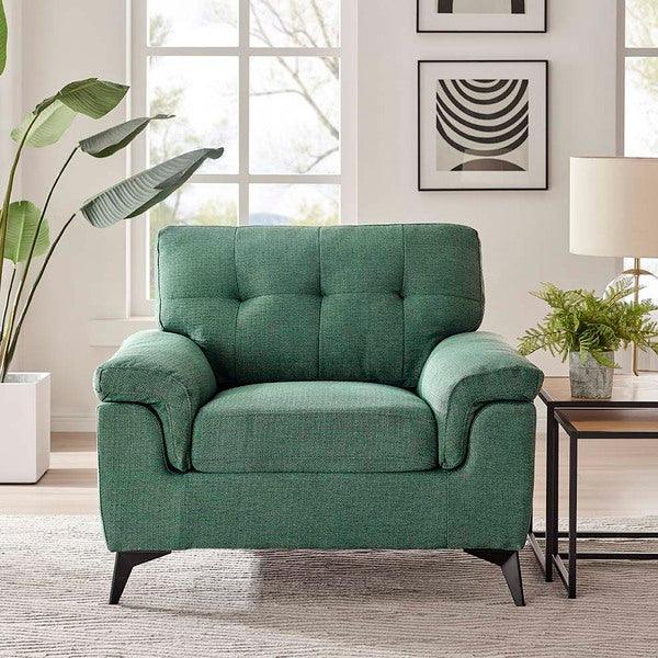 Green fabric armchair with tufted backrest in modern living room setting