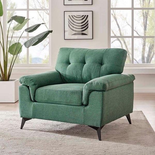 Green fabric armchair with tufted backrest and angled legs in modern living room