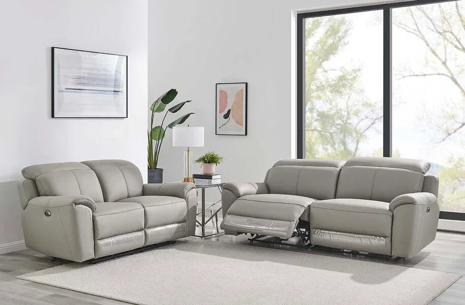 Grey leather recliner sofa set in modern living room with large window