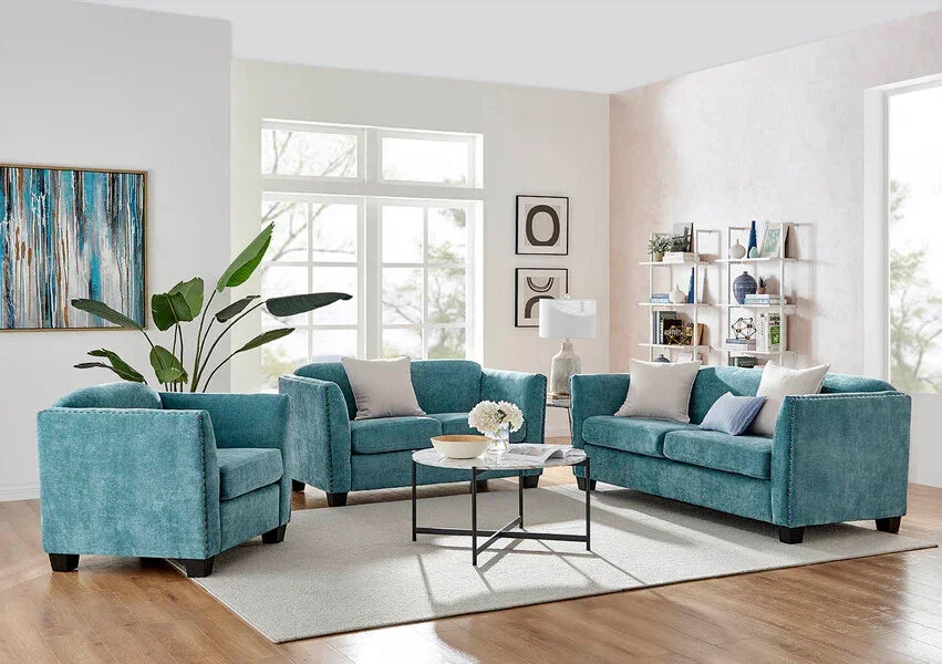 Teal fabric sofa set with armchair, coffee table, and cushions in modern living room