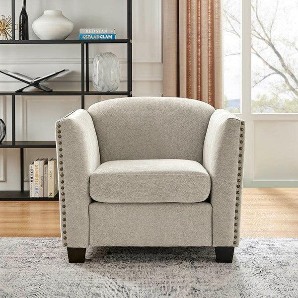 Light grey upholstered armchair with studded arms in modern living room