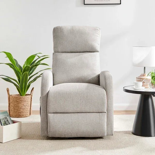 Light grey fabric recliner chair in modern living room with side table and plant