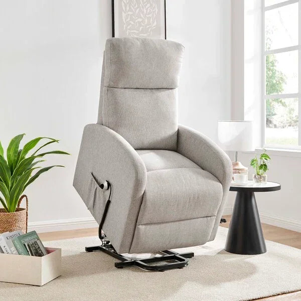 Light grey fabric recliner armchair with lift function in modern living room