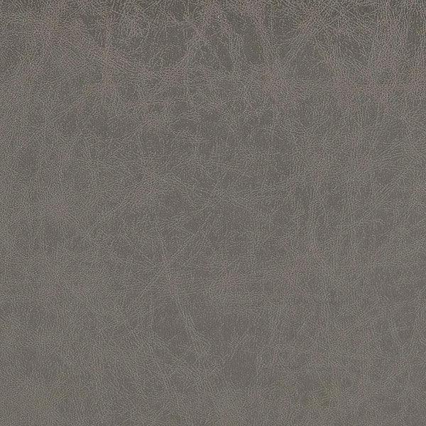Close-up of grey faux leather upholstery texture for sofa or armchair