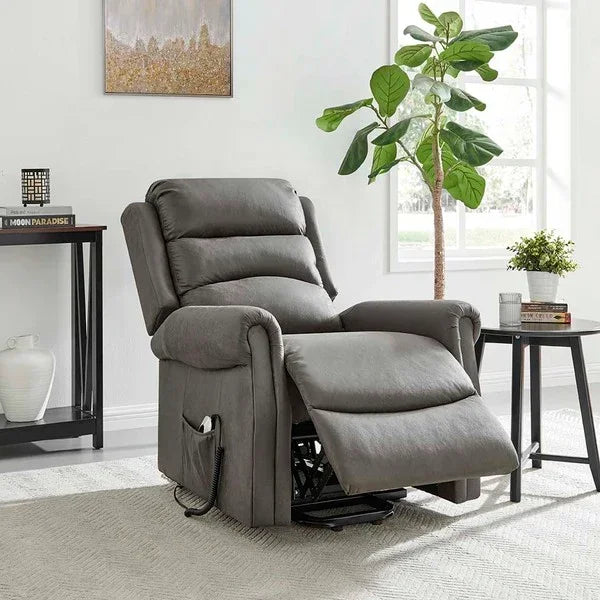 Grey fabric recliner chair with footrest extended in a bright living room