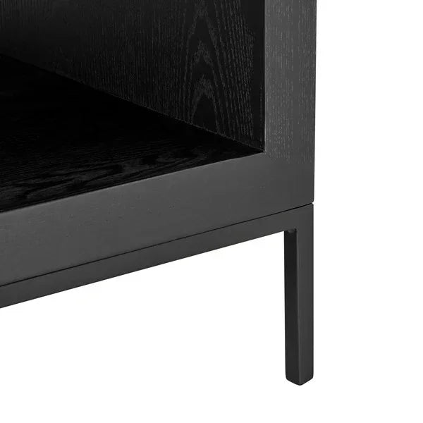 Black wood side table lower shelf and leg closeup