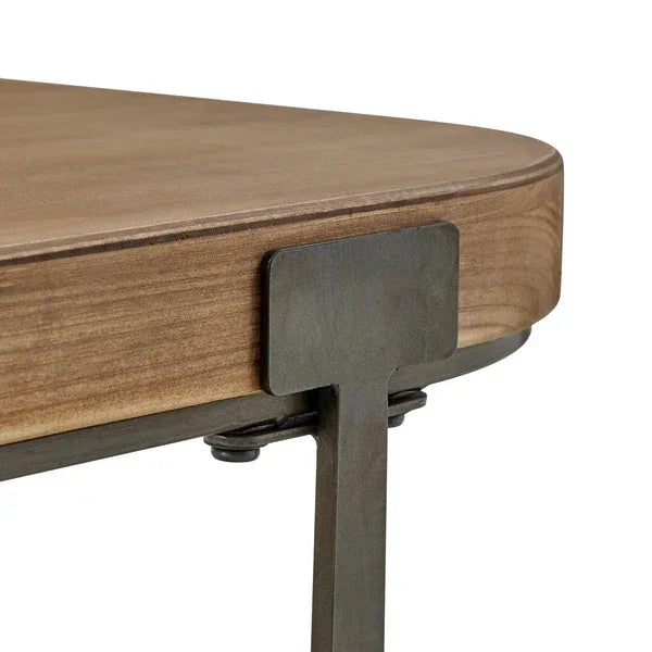Corner detail of wooden tabletop with black metal frame and industrial style support