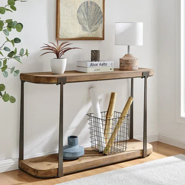 Industrial wood console table with metal frame, books, lamp, and decor in modern hallway