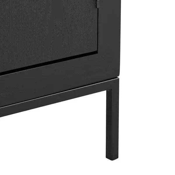 Black wooden cabinet corner with metal leg and flush door
