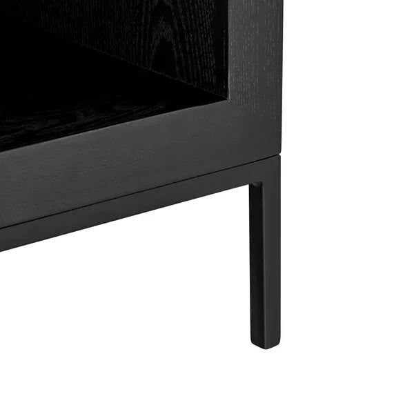 Black wood furniture leg and open shelf corner close-up