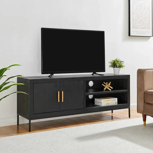 Black wooden TV unit with gold handles, open shelving and accessories in modern living room