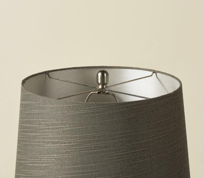 Grey fabric drum lampshade with subtle textured lines and metallic interior finish